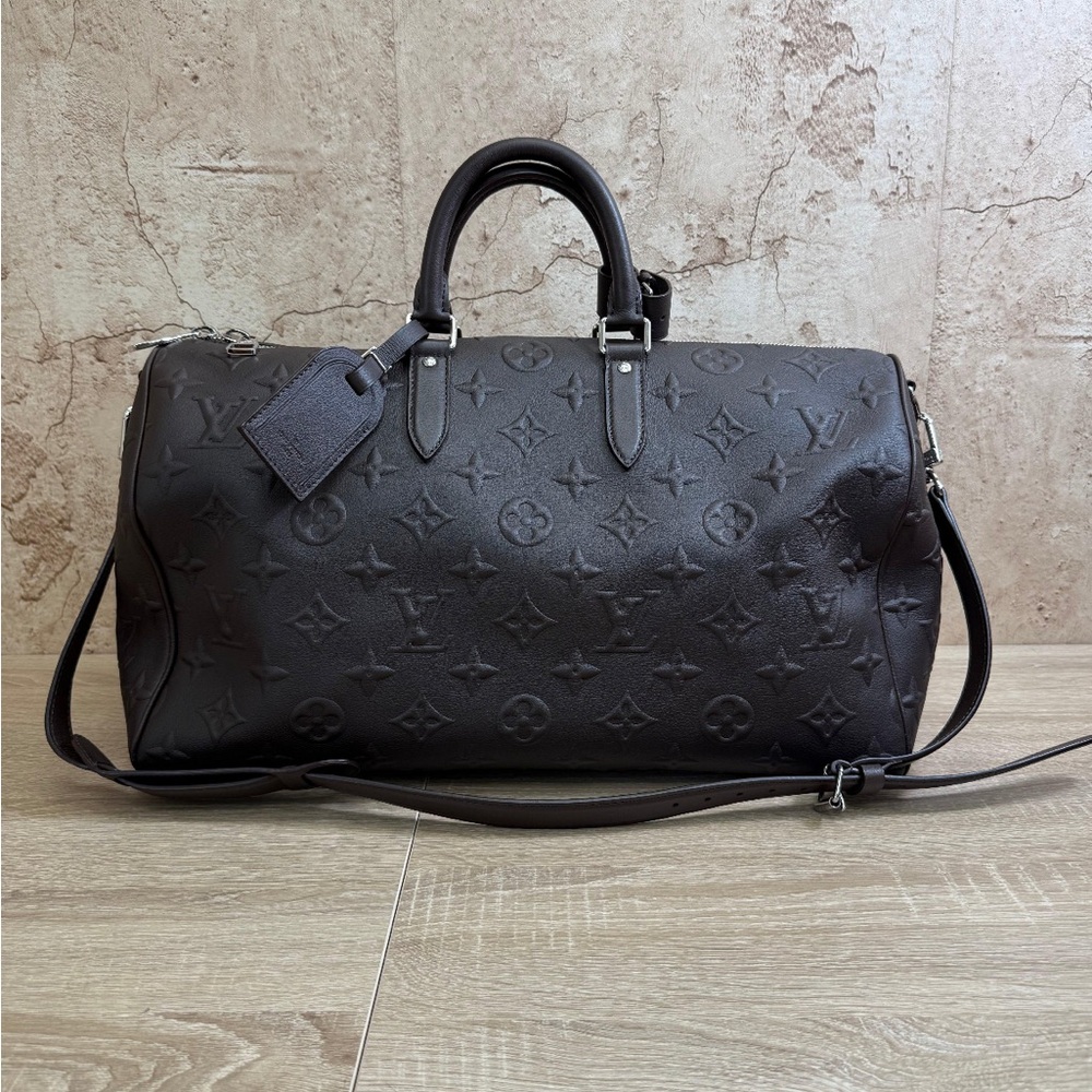 Louis Vuitton X EDUN Monogram Revelation Keepall 45 Bandouliere in mocha brown